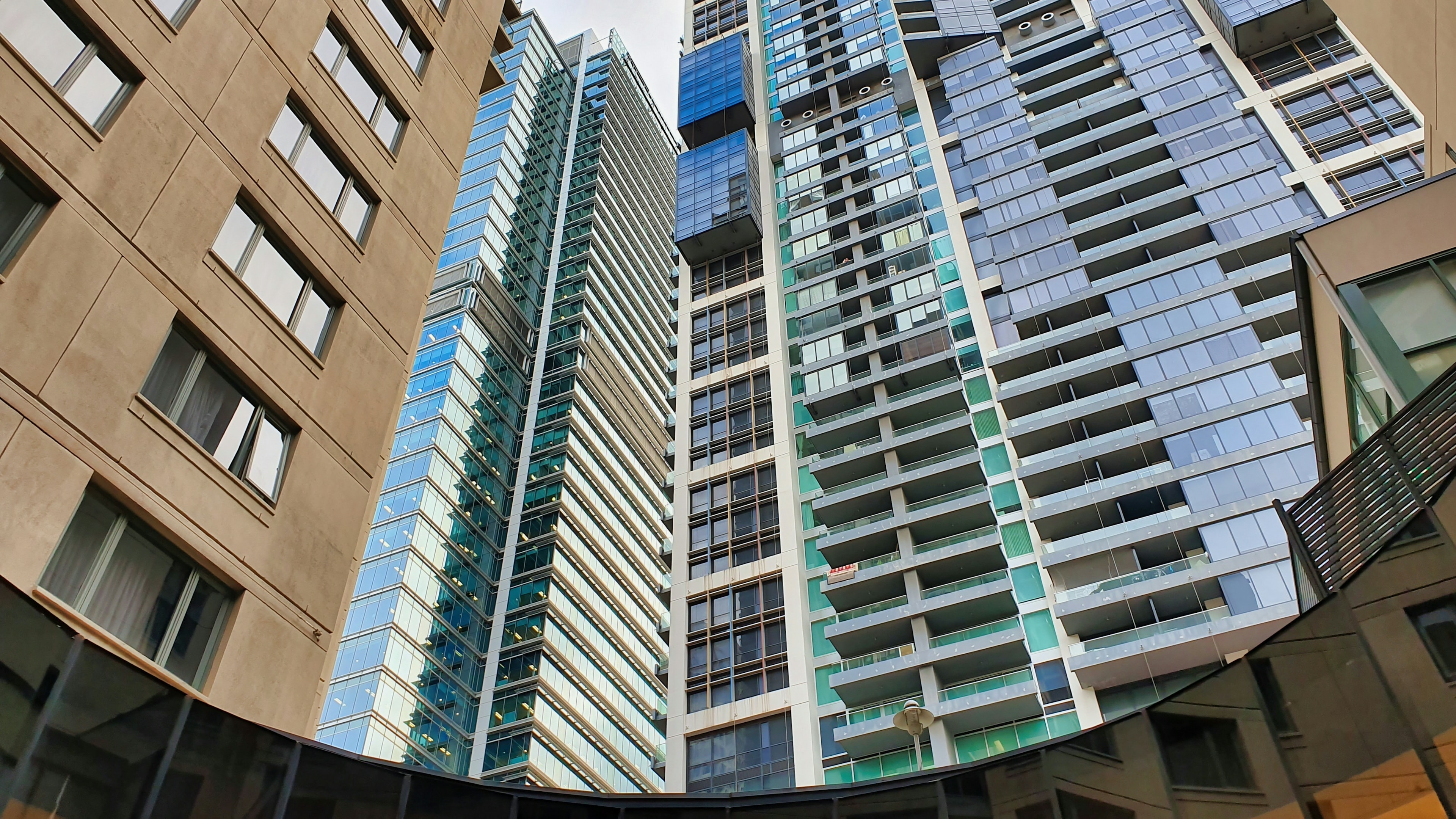 Glass-fronted apartment towers and balconies in Sydney.